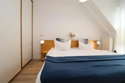 Ein Bett oder Betten in einem Zimmer der Unterkunft Birkenhof App 18