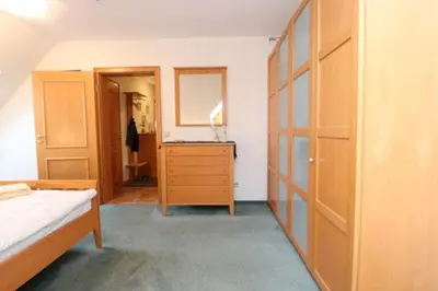 Ein Bett oder Betten in einem Zimmer der Unterkunft Birkenhof App 22