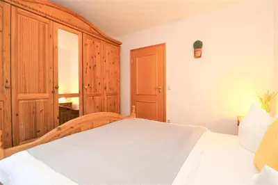 Ein Bett oder Betten in einem Zimmer der Unterkunft Birkenhof App 27