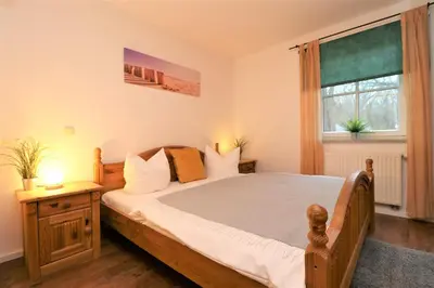 Ein Bett oder Betten in einem Zimmer der Unterkunft Birkenhof App 27