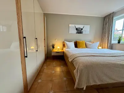 Ein Bett oder Betten in einem Zimmer der Unterkunft Birkenhof App 39