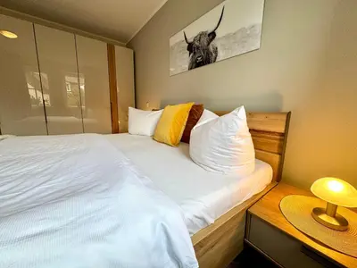 Ein Bett oder Betten in einem Zimmer der Unterkunft Birkenhof App 39