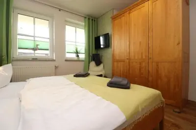 Ein Bett oder Betten in einem Zimmer der Unterkunft Birkenhof App 42