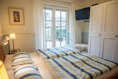 Ein Bett oder Betten in einem Zimmer der Unterkunft Birkenhof App 65 