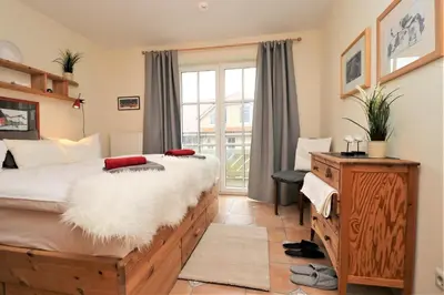 Ein Bett oder Betten in einem Zimmer der Unterkunft Birkenhof App 71