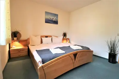 Ein Bett oder Betten in einem Zimmer der Unterkunft Birkenhof App 75