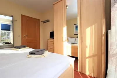 Ein Bett oder Betten in einem Zimmer der Unterkunft Birkenhof App 76