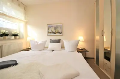 Ein Bett oder Betten in einem Zimmer der Unterkunft Birkenhof App 77