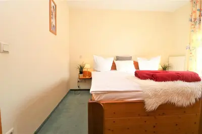Ein Bett oder Betten in einem Zimmer der Unterkunft Birkenhof App 77