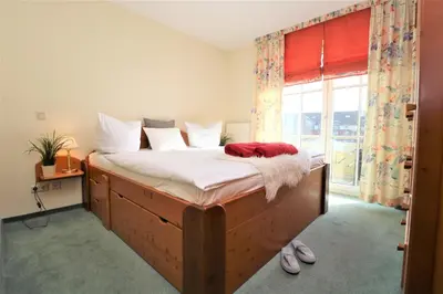 Ein Bett oder Betten in einem Zimmer der Unterkunft Birkenhof App 77