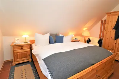 Ein Bett oder Betten in einem Zimmer der Unterkunft Haus Clarissa, App 02