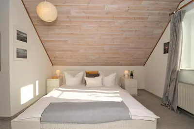 Ein Bett oder Betten in einem Zimmer der Unterkunft Ferienhäuser Doppelhaushälfte, Grüner Weg