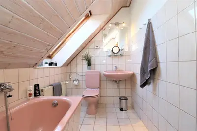 Ein Badezimmer in der Unterkunft Ferienhäuser Doppelhaushälfte, Grüner Weg