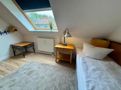 Ein Bett oder Betten in einem Zimmer der Unterkunft Oewern Diek App 08