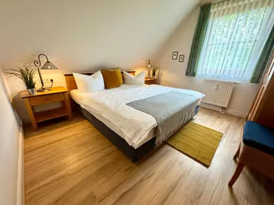 Ein Bett oder Betten in einem Zimmer der Unterkunft Oewern Diek App 08