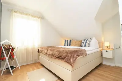 Ein Bett oder Betten in einem Zimmer der Unterkunft Oewern Diek App 12