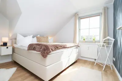 Ein Bett oder Betten in einem Zimmer der Unterkunft Oewern Diek App 13