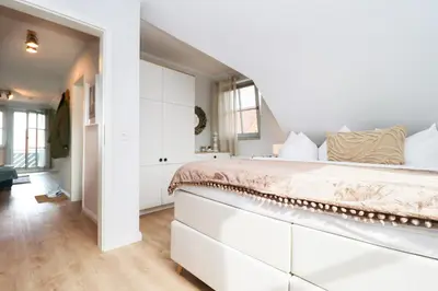 Ein Bett oder Betten in einem Zimmer der Unterkunft Oewern Diek App 13
