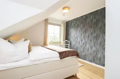 Ein Bett oder Betten in einem Zimmer der Unterkunft Oewern Diek App 13