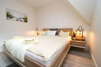 Ein Bett oder Betten in einem Zimmer der Unterkunft Oewern Diek App 29
