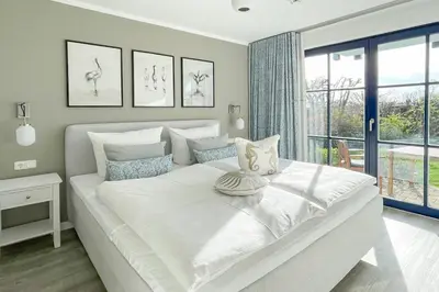 Ein Bett oder Betten in einem Zimmer der Unterkunft Oewern Diek App 39