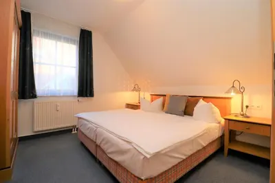 Ein Bett oder Betten in einem Zimmer der Unterkunft Oewern Diek App 44