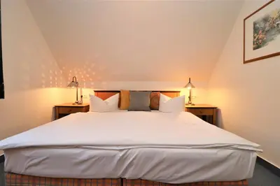 Ein Bett oder Betten in einem Zimmer der Unterkunft Oewern Diek App 44