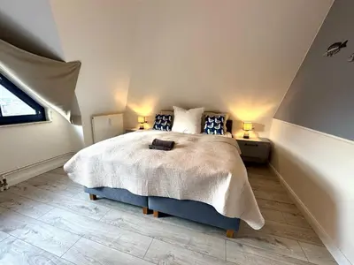 Ein Bett oder Betten in einem Zimmer der Unterkunft Oewern Diek App 47