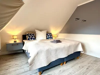 Ein Bett oder Betten in einem Zimmer der Unterkunft Oewern Diek App 47