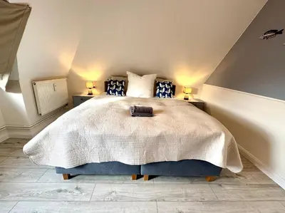 Ein Bett oder Betten in einem Zimmer der Unterkunft Oewern Diek App 47