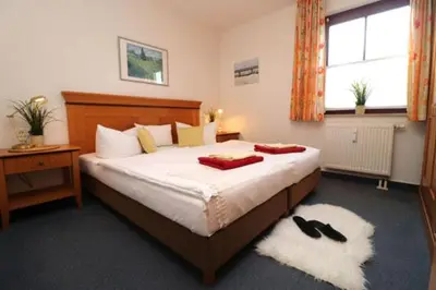 Ein Bett oder Betten in einem Zimmer der Unterkunft Oewern Diek App 49