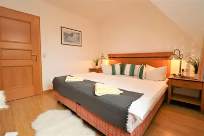 Ein Bett oder Betten in einem Zimmer der Unterkunft Oewern Diek App 54