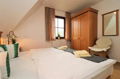 Ein Bett oder Betten in einem Zimmer der Unterkunft Oewern Diek App 54