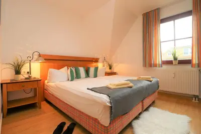 Ein Bett oder Betten in einem Zimmer der Unterkunft Oewern Diek App 54
