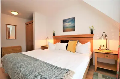 Ein Bett oder Betten in einem Zimmer der Unterkunft Oewern Diek App 55