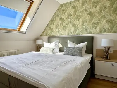 Ein Bett oder Betten in einem Zimmer der Unterkunft Oewern Diek App 57
