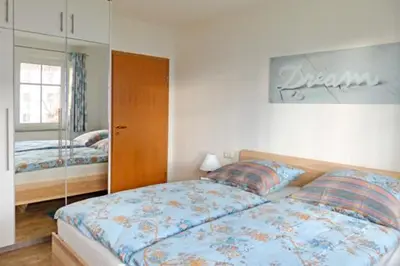 Ein Bett oder Betten in einem Zimmer der Unterkunft Wohnpark Strandstraße App 05 Ostseesuite