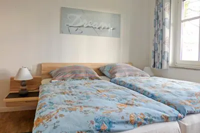 Ein Bett oder Betten in einem Zimmer der Unterkunft Wohnpark Strandstraße App 05 Ostseesuite