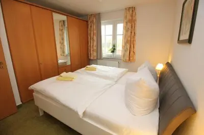 Ein Bett oder Betten in einem Zimmer der Unterkunft Wohnpark Strandstraße App 06