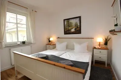 Ein Bett oder Betten in einem Zimmer der Unterkunft Wohnpark Strandstraße App 12
