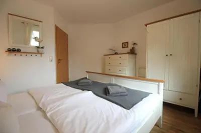 Ein Bett oder Betten in einem Zimmer der Unterkunft Wohnpark Strandstraße App 12