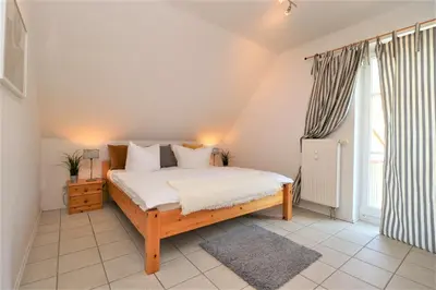Ein Bett oder Betten in einem Zimmer der Unterkunft Wohnpark Schmiedestraße App 03