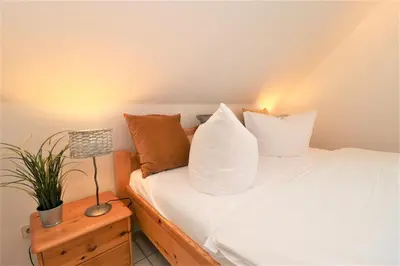 Ein Bett oder Betten in einem Zimmer der Unterkunft Wohnpark Schmiedestraße App 03