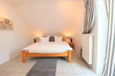 Ein Bett oder Betten in einem Zimmer der Unterkunft Wohnpark Schmiedestraße App 03