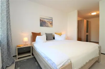 Ein Bett oder Betten in einem Zimmer der Unterkunft Wohnpark Schmiedestraße App 18