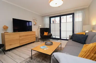 TV/Unterhaltungsangebot in der Unterkunft Oewern Diek Appartement 41